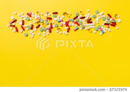 Protective face masks or surgical masks, medicine pills and thermometer on table background. Coronavirus disease. Corona virus concept. Space for text 87325974