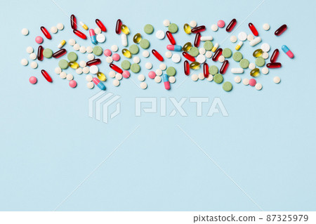 Protective face masks or surgical masks, medicine pills and thermometer on table background. Coronavirus disease. Corona virus concept. Space for text 87325979