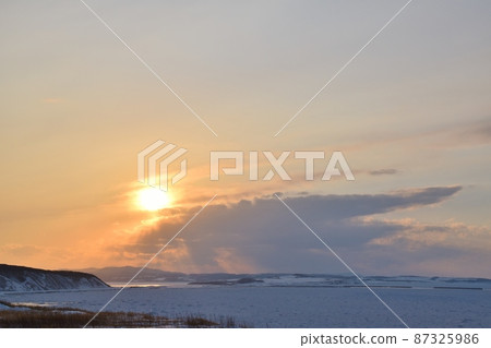 Sunset and drift ice at Notoro Misaki Hokkaido 87325986