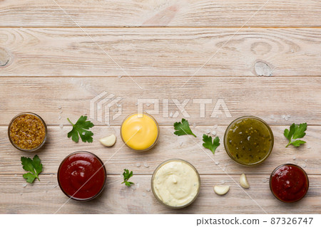 Many different sauces and herbs on table, flat lay top view. sauces with spices healthy concept Many different sauces and herbs on table, flat lay top view. sauces with spices healthy concept 87326747