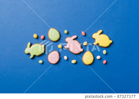 holiday preparation Multi colors Easter eggs with cookies on colored background . Pastel color Easter eggs. holiday concept with copy space holiday preparation Multi colors Easter eggs with cookies on colored background . Pastel color Easter eggs. holiday concept with copy space 87327177