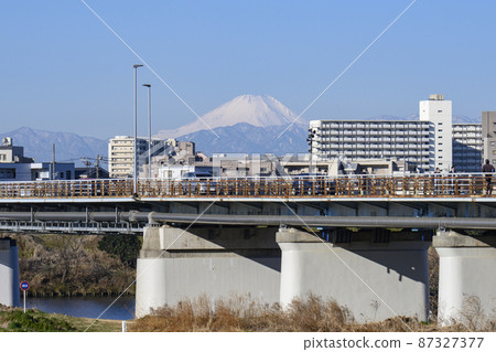 Mt. Fuji seen from the left bank of the Tama River over the gas bridge Mt. Fuji seen from the left bank of the Tama River over the gas bridge 87327377