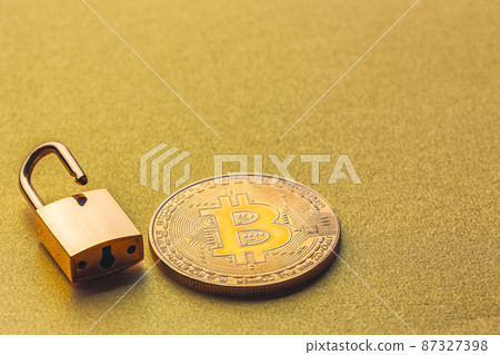 Unlock bitcoin, background with bitcoin and lock Unlock bitcoin, background with bitcoin and lock 87327398