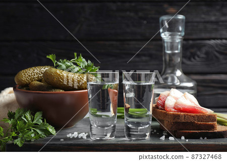 Cold Russian vodka with snacks on table Cold Russian vodka with snacks on table 87327468