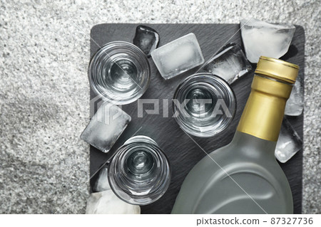 Cold Russian vodka on grey table, flat lay 87327736