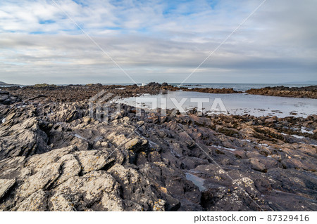 The rocks of Carrickfad by Portnoo at Narin Strand in County Donegal Ireland The rocks of Carrickfad by Portnoo at Narin Strand in County Donegal Ireland 87329416