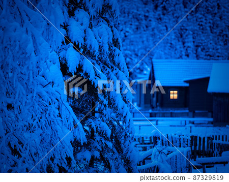 night is coming, old house covered with snow on the background of the forest night is coming, old house covered with snow on the background of the forest 87329819