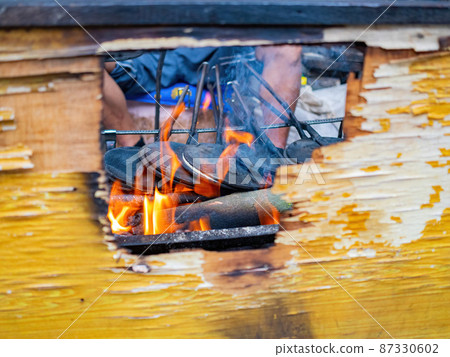 Close up shot of man grilling  food 87330602
