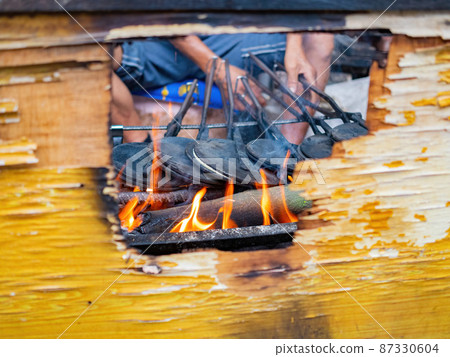 Close up shot of man grilling food Close up shot of man grilling food 87330604