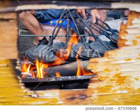 Close up shot of man grilling  food 87330606