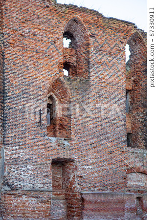 Wall with loophole windows. Fragment of Tilsit castle. Sovetsk. Kaliningrad region. Russia 87330911
