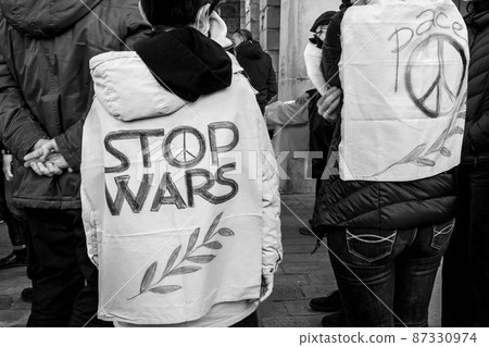 Genoa, Italy - 02 26 2022: Demonstration against Russian war in Ukraine. Genoa, Italy - 02 26 2022: Demonstration against Russian war in Ukraine. 87330974