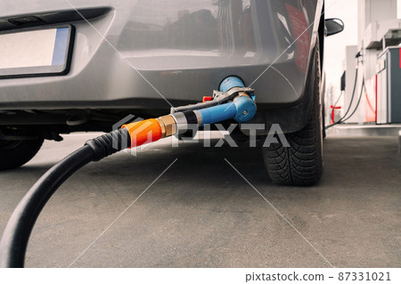 Fuel car. Pump petrol from nozzle in vehicle tank. Gasoline, oil gas station. Economy business with diesel transport. Automotive transportation concept. 87331021