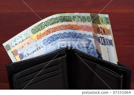 Libyan dinar in the black wallet 87331064
