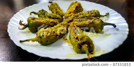 Stuffed Green Chillies fry, Bharwa Masala Mirch or Bharli Mirchi, sandgi Mirchi. Stuffed Green Chillies fry, Bharwa Masala Mirch or Bharli Mirchi, sandgi Mirchi. 87331853