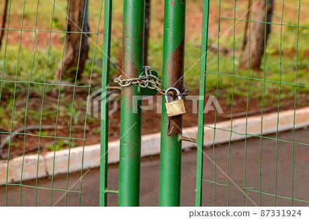 green metallic gate locked 87331924