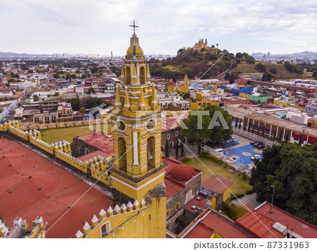 Aerial Drone Shot of San Gabriel Archangel Cathedral at cloudy day in Cholula, Puebla, Mexico 87331963