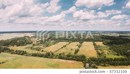Aerial View Spring Green Field With Windbreaks Landscape. Top View Of Field And Forest Belt. Drone View Bird's Eye View. A Windbreak Or Shelterbelt Is A Planting Usually To Protect Soil From Erosion 87332108