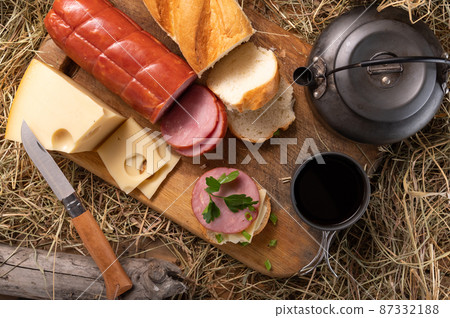 Fresh sausage and cheese sandwich. Breakfast in the barn. Breakfast in the village. Fresh sausage and cheese sandwich. Breakfast in the barn. Breakfast in the village. 87332188