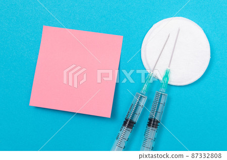 Vaccination or Revaccination Concept - Two Medical Syringe on Blue Table 87332808