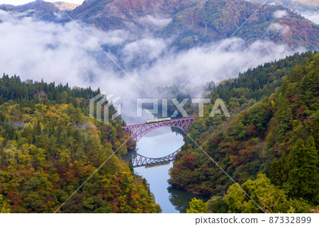 Tadami Line going through the canyons of Fukushima, autumn leaves, and the sea of clouds 87332899
