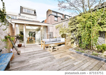 The courtyard of an elite house with trees and a garden The courtyard of an elite house with trees and a garden 87333751