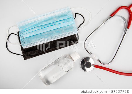 Black and Blue Doctor mask, hand sanitizer and stethoscope 87337738