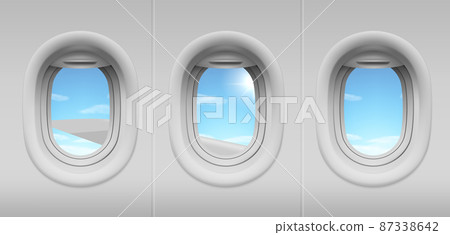 Airplane portholes with sky and wing view Airplane portholes with sky and wing view 87338642