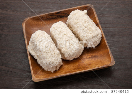 Frozen crab cream croquette before cooking Frozen crab cream croquette before cooking 87340415