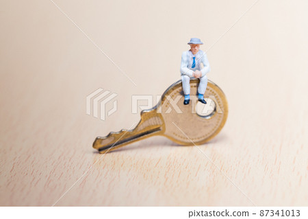 Businessman sitting on the key Businessman sitting on the key 87341013