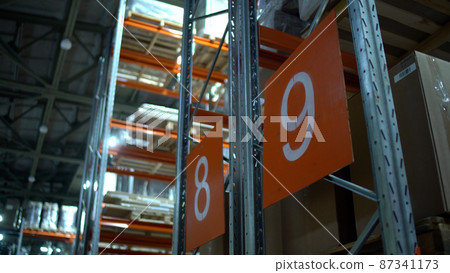 Warehouse with cardboard boxes inside on pallets racks, logistic center. Huge, large modern warehouse. Warehouse filled with cardboard boxes on shelves Warehouse with cardboard boxes inside on pallets racks, logistic center. Huge, large modern warehouse. Warehouse filled with cardboard boxes on shelves 87341173