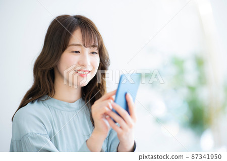 Female smartphone Female smartphone 87341950