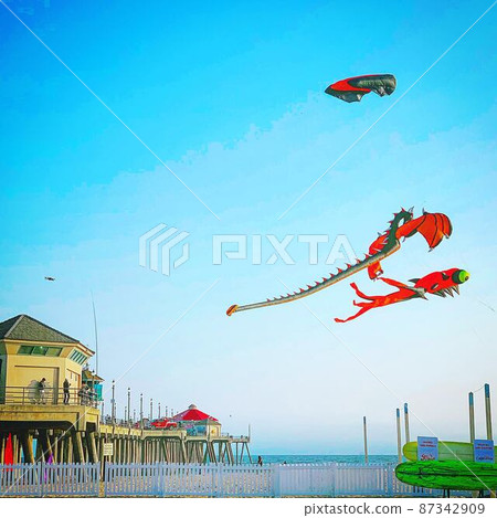 A kite fluttering in the blue sky and wind of California on the west coast of the United States A kite fluttering in the blue sky and wind of California on the west coast of the United States 87342909