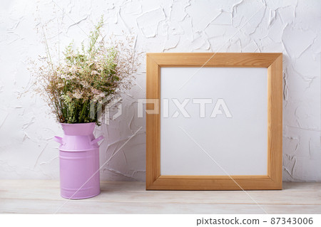 Square wooden picture frame mockup with wild grass in the pink can Square wooden picture frame mockup with wild grass in the pink can 87343006