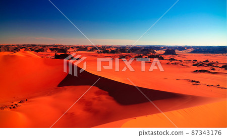 Sunset view to Tin Merzouga dune at Tassili nAjjer national park in Algeria 87343176