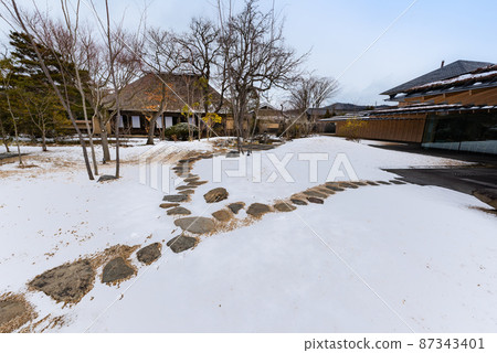 Tome-cho samurai residence in the snowy landscape of Meiji-mura in Miyagi Tome-cho samurai residence in the snowy landscape of Meiji-mura in Miyagi 87343401