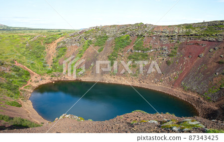 Kerid is a beautiful crater lake of a turquoise color located on the South-West of Iceland Kerid is a beautiful crater lake of a turquoise color located on the South-West of Iceland 87343425
