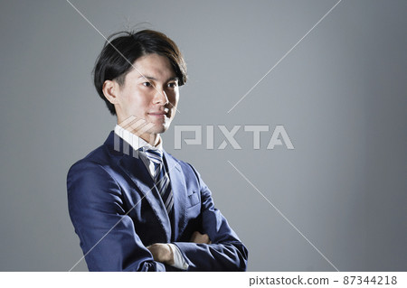 Businessman portrait gray background 87344218