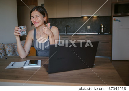 young asian woman at home, remote work 87344618