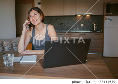 young asian woman at home, remote work 87344619