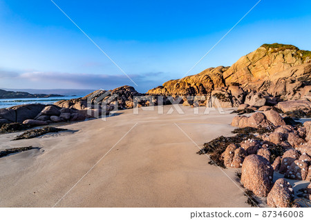 The beautiful stones at Cloughglass bay and beach by Burtonport in County Donegal - Ireland The beautiful stones at Cloughglass bay and beach by Burtonport in County Donegal - Ireland 87346008
