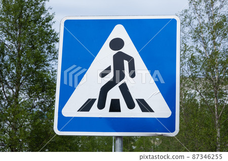 Road sign pedestrian crossing. Zebra crossing, pedestrian cross warning traffic sign in blue and Road sign pedestrian crossing. Zebra crossing, pedestrian cross warning traffic sign in blue and 87346255