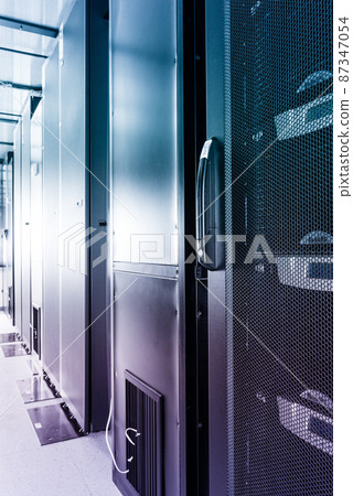 data center with row of data storage cabinets 87347054