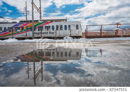Sky, puddle and train [Kamikochi Line] 87347551