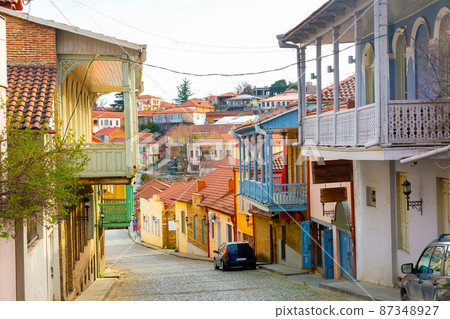 Narrow cobbled street of Signagi with typical buildings Narrow cobbled street of Signagi with typical buildings 87348927