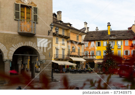 Piazza del Mercato in Italian town of Domodossola with Christmas tree Piazza del Mercato in Italian town of Domodossola with Christmas tree 87348975