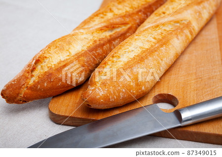 French loaves on wooden surface French loaves on wooden surface 87349015