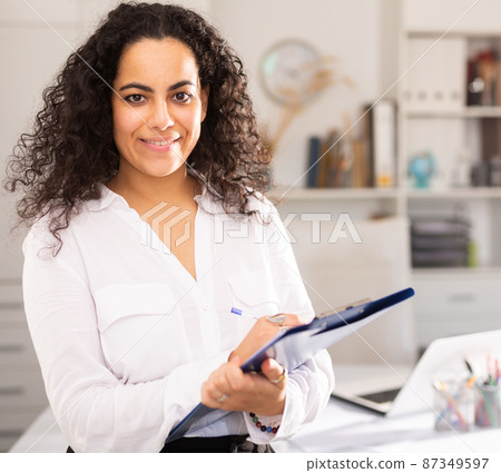 Business woman politely welcoming to office Business woman politely welcoming to office 87349597