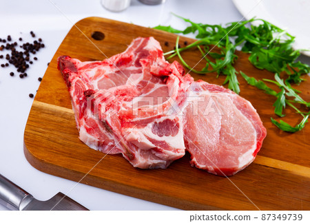 Fresh raw pork loin chops with condiments 87349739