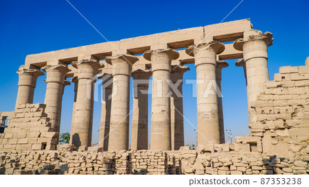 Luxor Temple in Luxor, ancient Thebes, Egypt. Luxor Temple is a large Ancient Egyptian temple complex located on the east bank of the Nile River and was constructed approximately 1400 BCE. 87353238